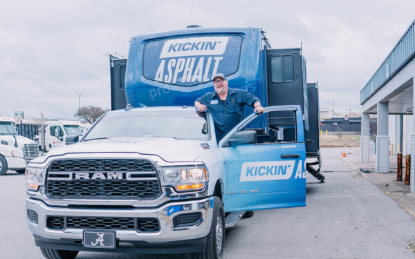 JobNimbus growth specialist Ronnie Smith near his "Kickin' Asphalt" contractor truck and RV during his tour around the U.S.