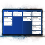 Laptop open with JobNimbus Boards showing different steps of a contractor's process