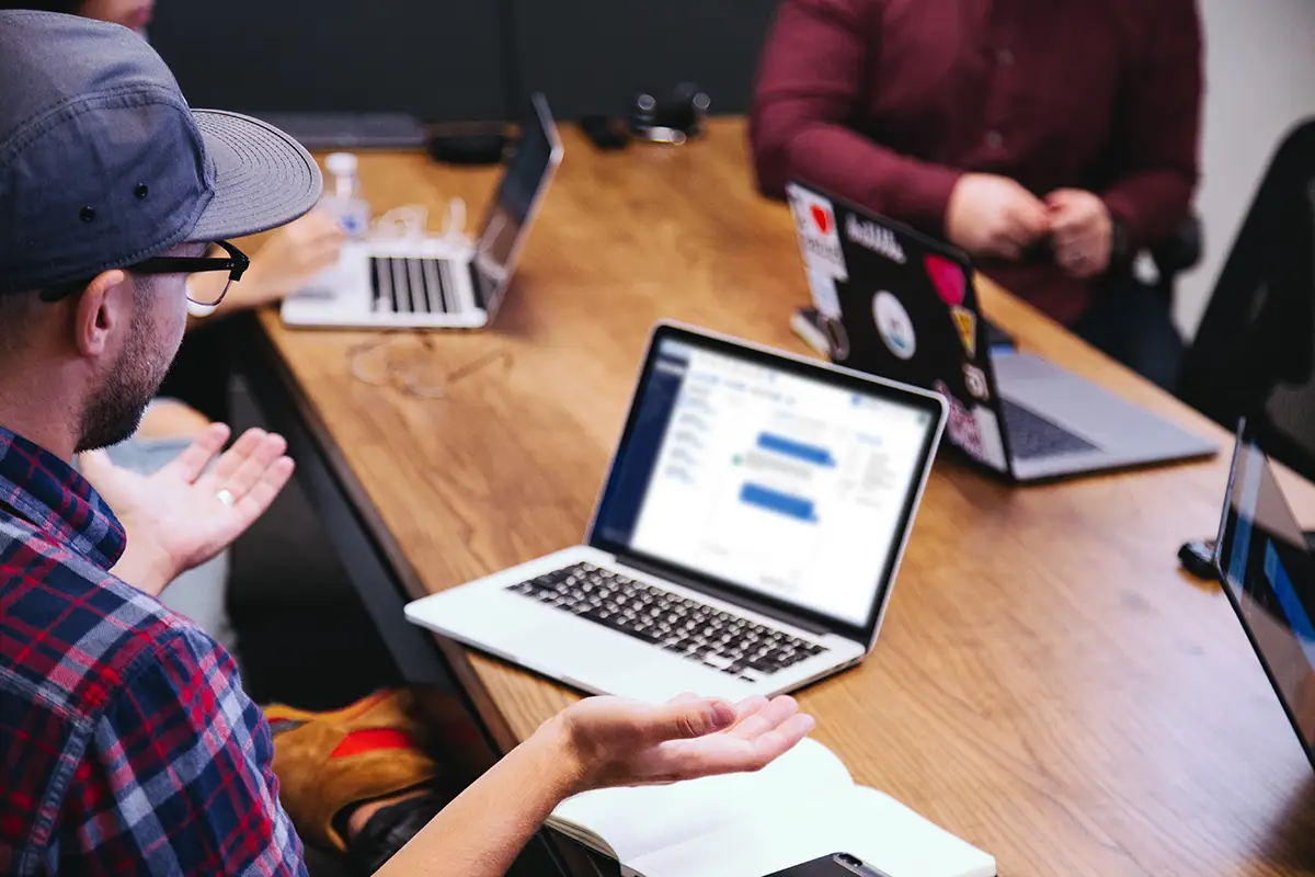 People sitting around conference room table during a training session