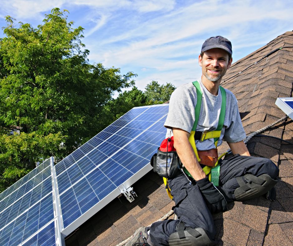 Solar Installer on roof with solar panels