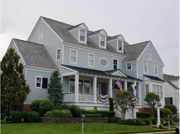 blue colonial house with gray shingles