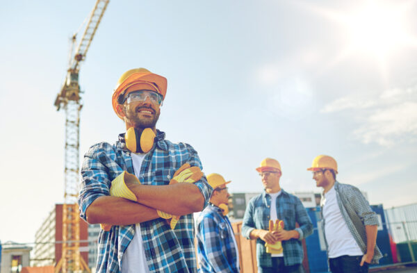 Roofing contractor with a group of roofing employees after hiring