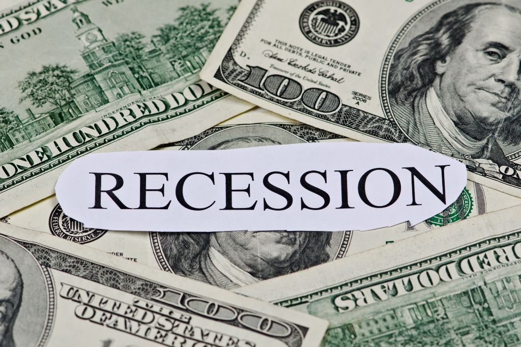 $100 bills surrounding the word "Recession"
